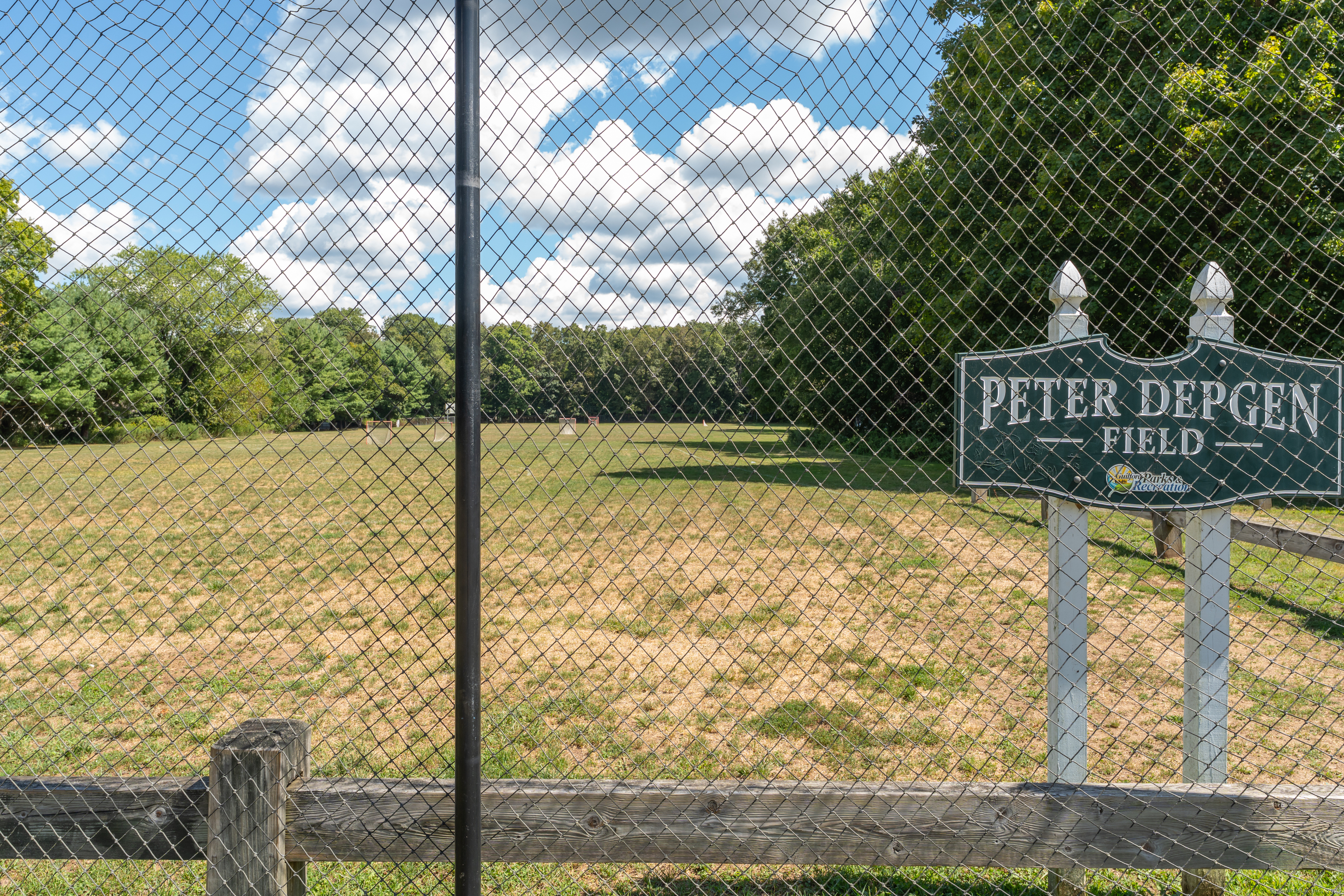 64 Dohm Avenue Guilford, CT 06437 - Photo 32 of 38 a view of a wooden fence and trees