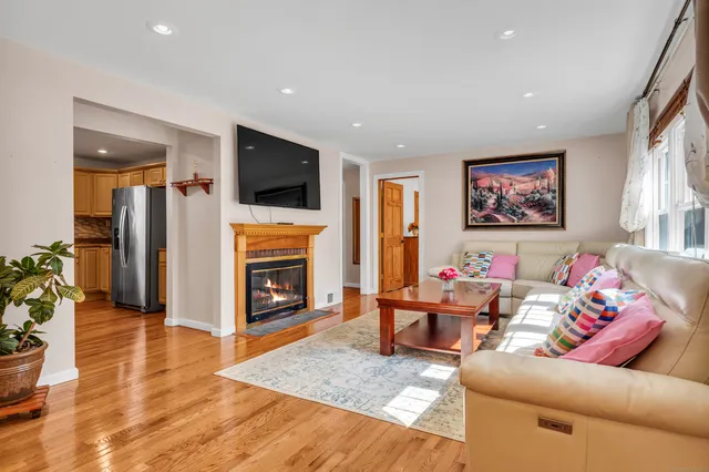 a view of a dining room with furniture and chandelier