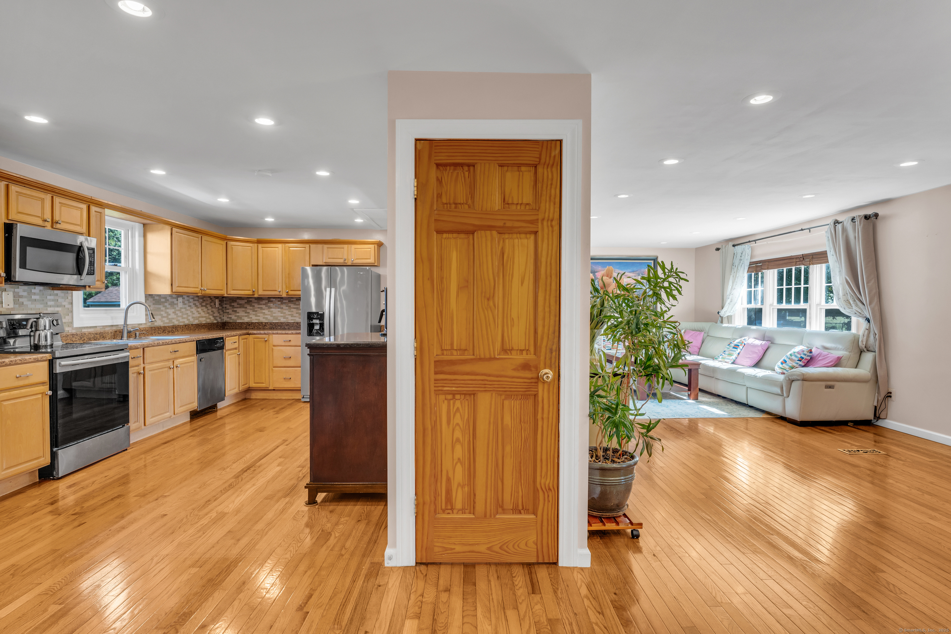 64 Dohm Avenue Guilford, CT 06437 - Photo 7 of 38 a kitchen with sink cabinets and wooden floor