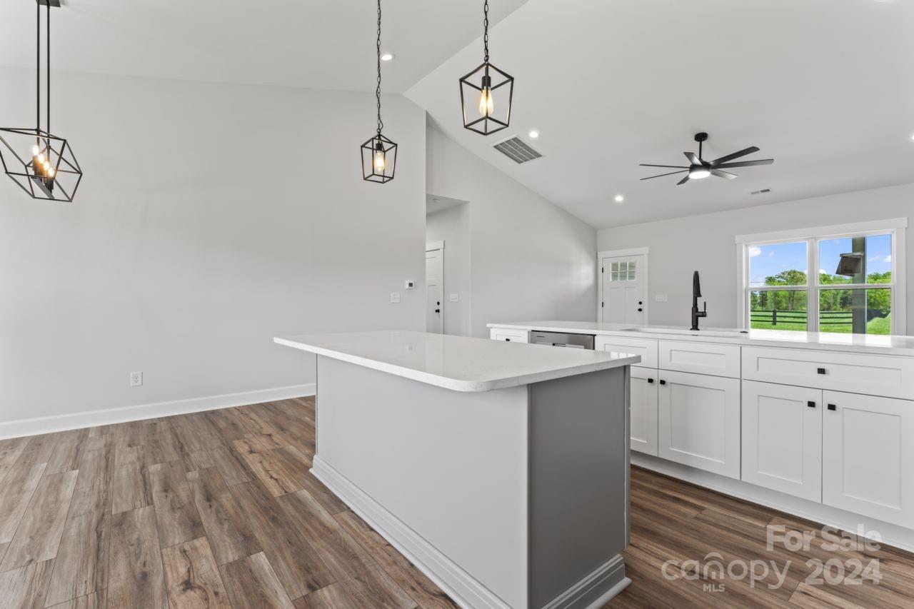 234 Briggs Road Salisbury, NC 28147 - Photo 11 of 35 a kitchen with a sink a window and stainless steel appliances