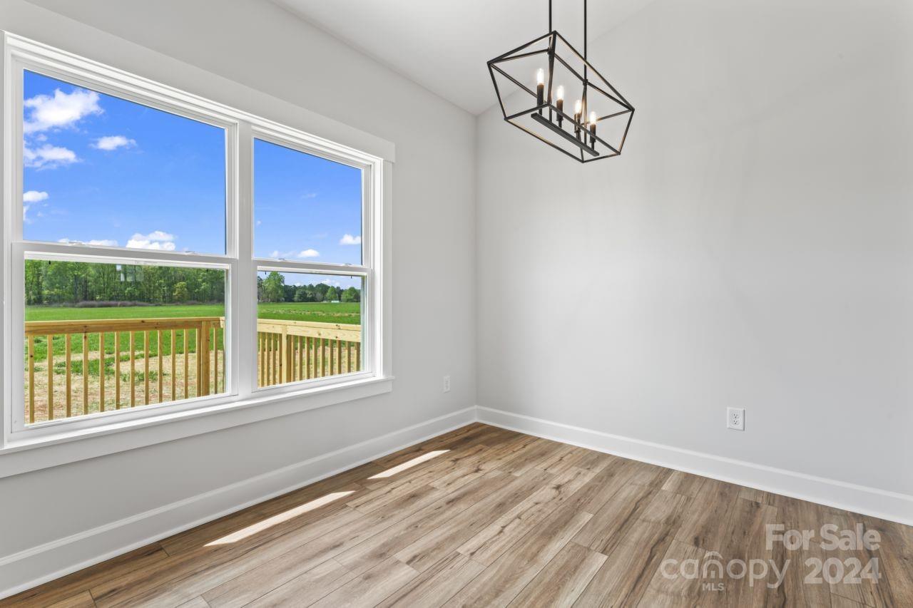 234 Briggs Road Salisbury, NC 28147 - Photo 12 of 35 a view of a room with wooden floor and windows