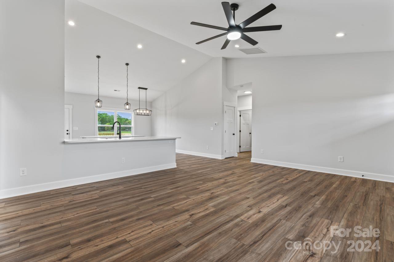 234 Briggs Road Salisbury, NC 28147 - Photo 14 of 35 an empty room with wooden floor and windows