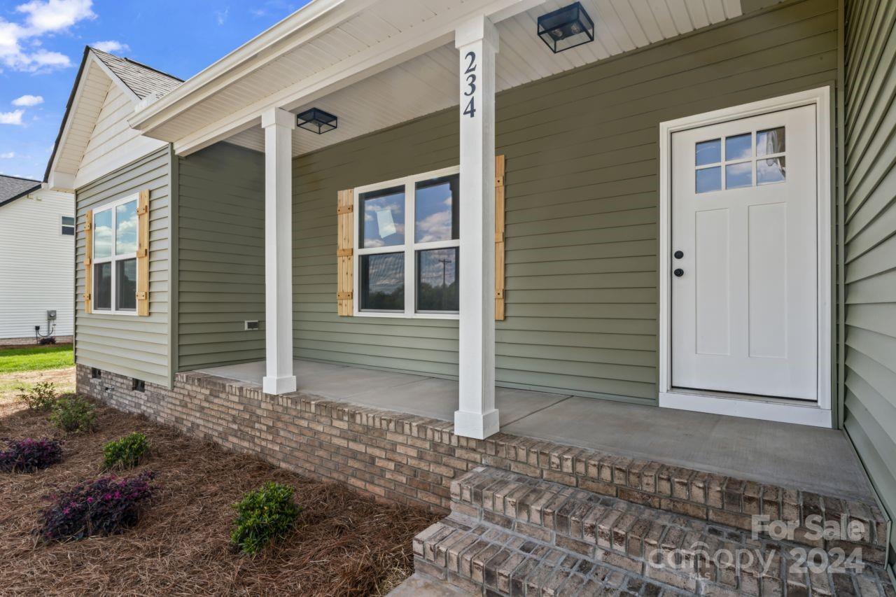 234 Briggs Road Salisbury, NC 28147 - Photo 2 of 35 a view of a house with backyard and porch