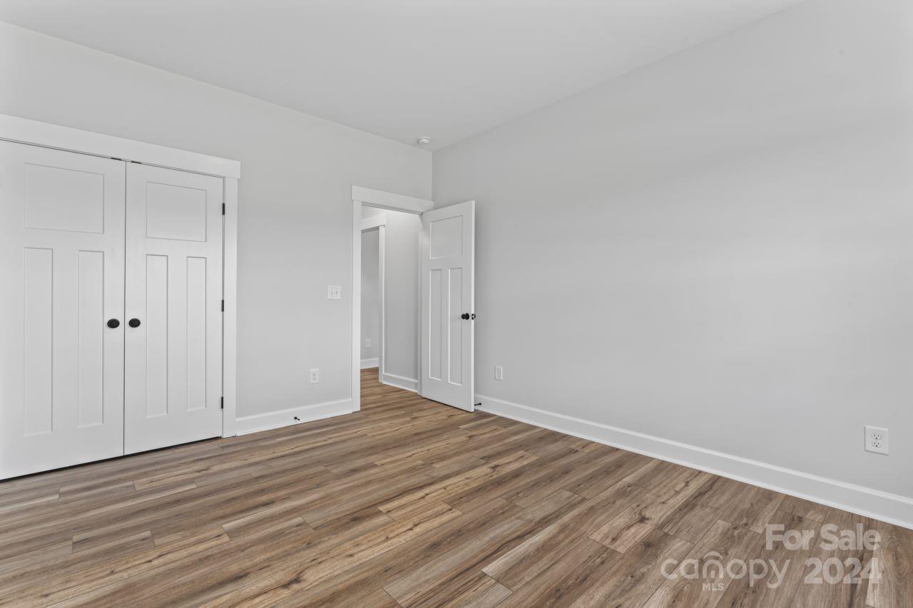 234 Briggs Road Salisbury, NC 28147 - Photo 25 of 35 a view of an empty room with wooden floor