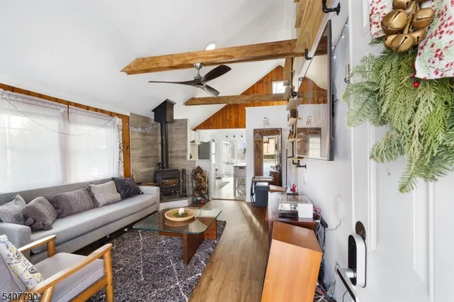 a living room with patio furniture and a floor to ceiling window