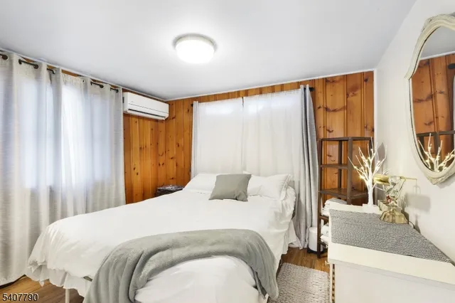 a bedroom with a large bed and a window