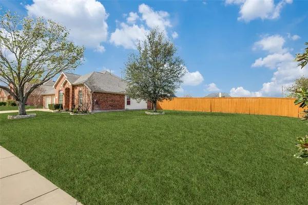a view of yard with swimming pool and green space