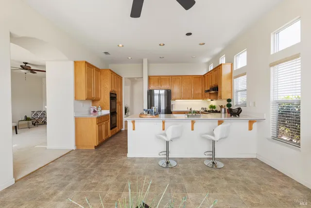 a bathroom with a tub a sink and mirror