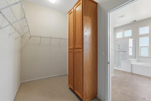 a bathroom with a granite countertop sink a toilet and shower
