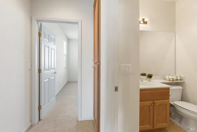 a view of living room with patio furniture and floor to ceiling windows