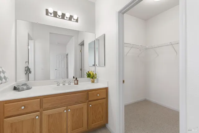 a view of a lake with houses in the back