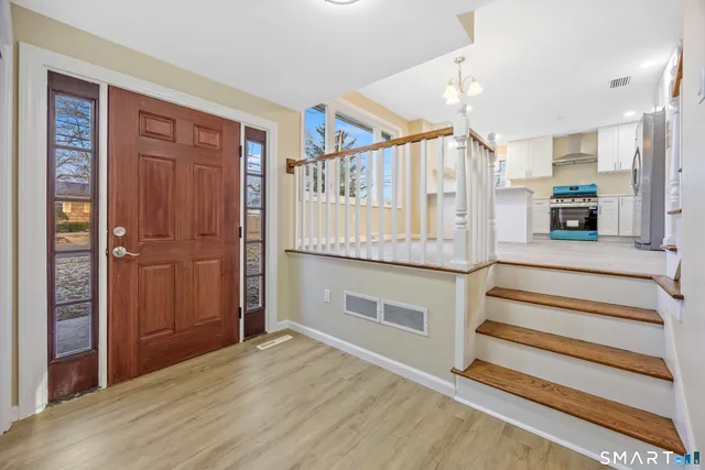a view of kitchen with cabinets and wooden floor
