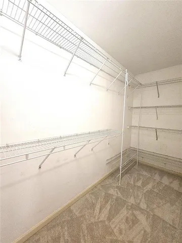 a view of a room with racks on the wall