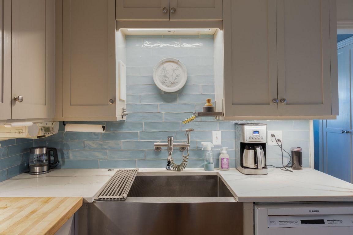 2102 Travis Heights Boulevard Austin, TX 78704 - Photo 14 of 28 a kitchen with a sink and cabinets
