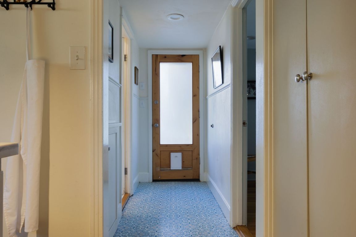 2102 Travis Heights Boulevard Austin, TX 78704 - Photo 15 of 28 a view of a hallway with wooden floor