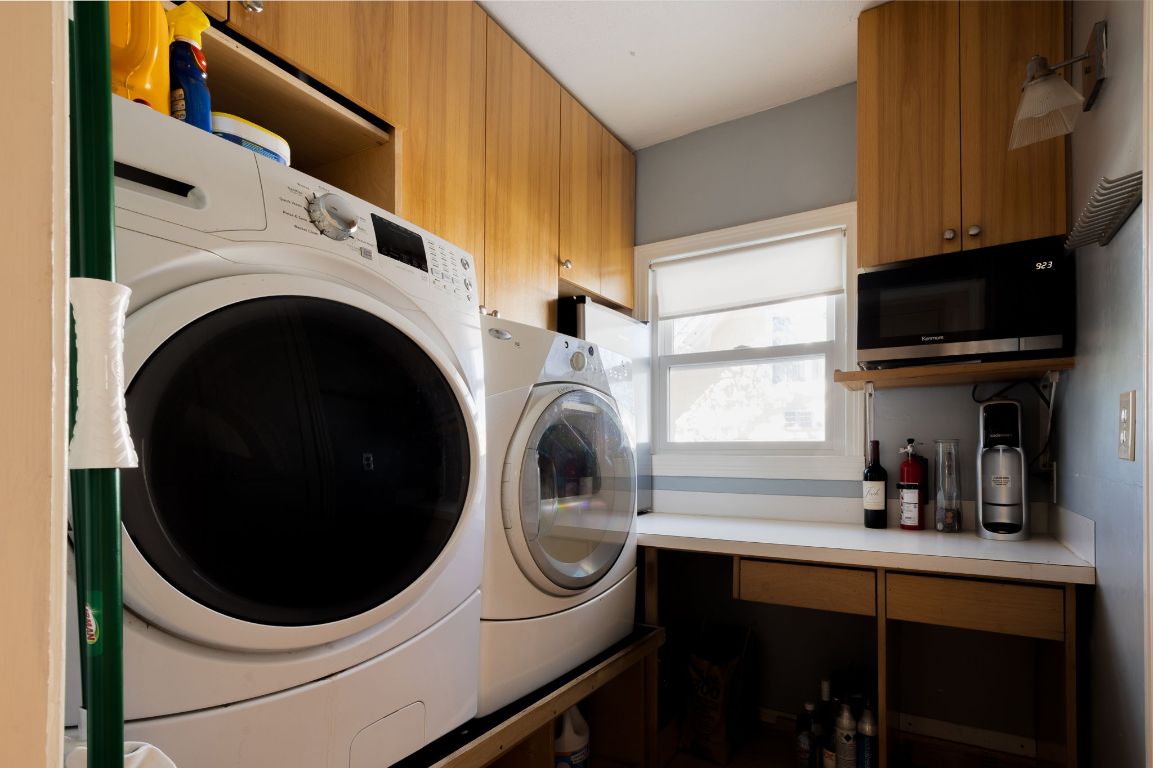 2102 Travis Heights Boulevard Austin, TX 78704 - Photo 16 of 28 a utility room with sink dryer and washer