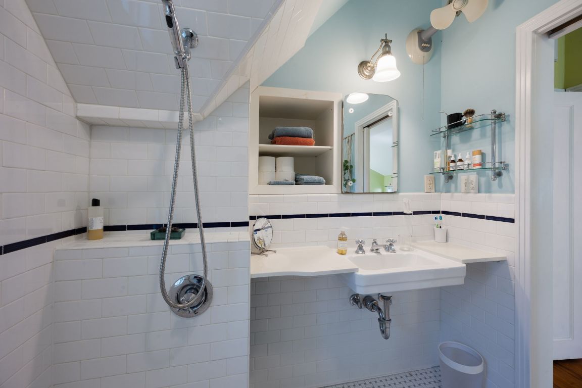 2102 Travis Heights Boulevard Austin, TX 78704 - Photo 27 of 28 a bathroom with a sink a toilet and mirror