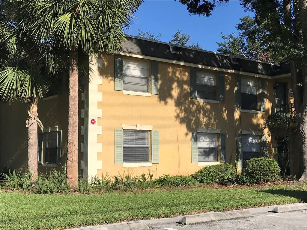 7600 Forest City Road, Unit A1 Orlando, FL 32810 - Photo 1 of 1 a front view of a house with garden