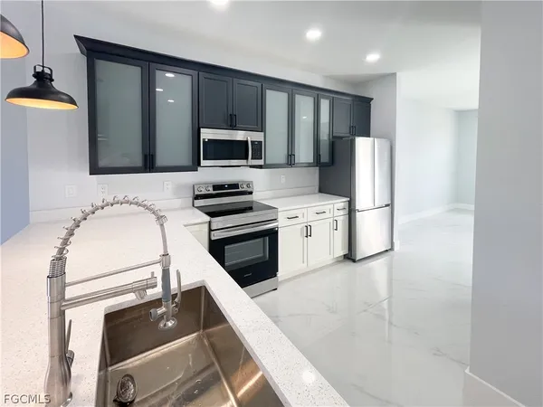 an aerial view of a residential houses with outdoor space