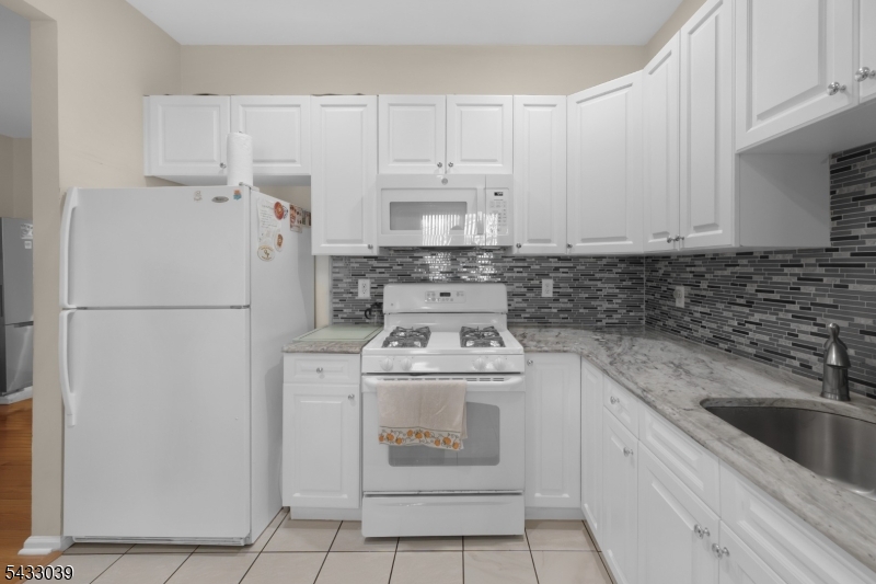 158 Autumn Ridge Road Morris Plains, NJ 07950 - Photo 2 of 26 a kitchen with a stove sink and refrigerator