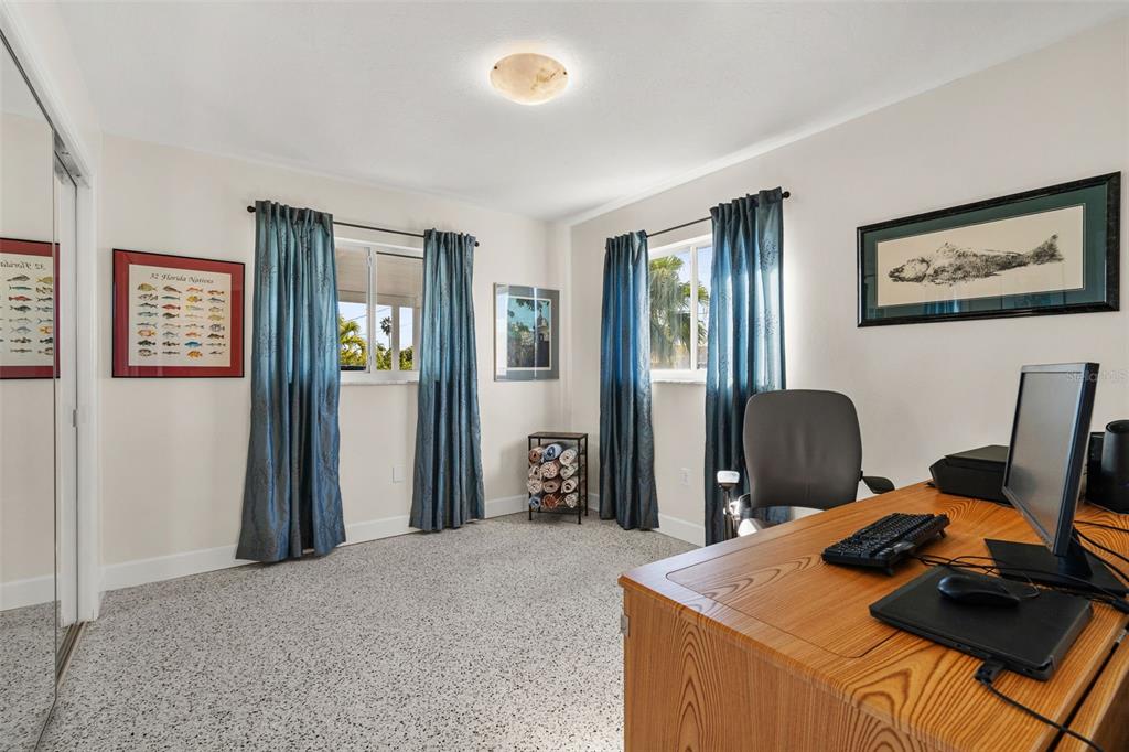 4908 Arlington Road Palmetto, FL 34221 - Photo 20 of 36 a view of a workspace with furniture and a window