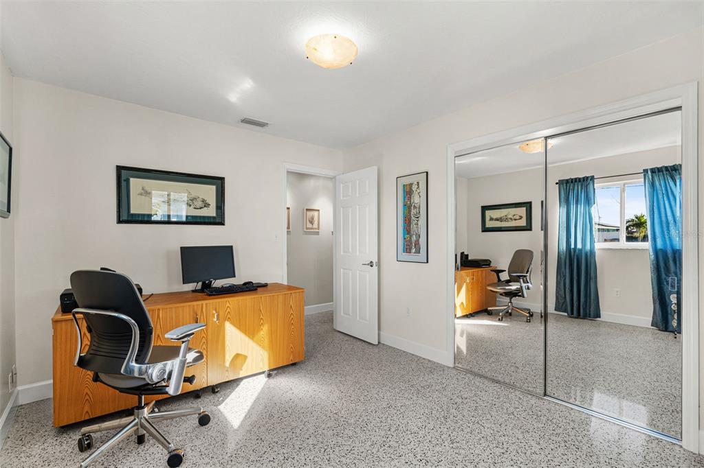 4908 Arlington Road Palmetto, FL 34221 - Photo 21 of 36 a view of a workspace with furniture and a window