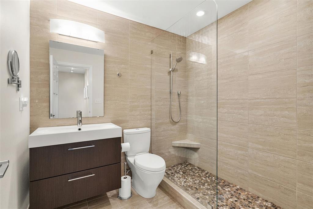 4908 Arlington Road Palmetto, FL 34221 - Photo 22 of 36 a bathroom with a sink toilet and shower