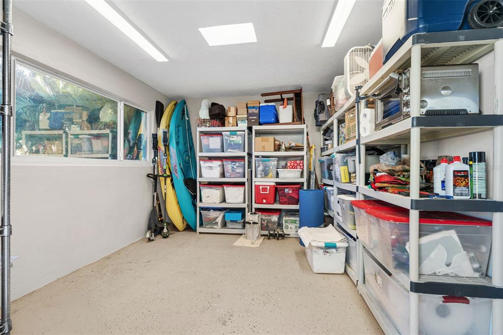 4908 Arlington Road Palmetto, FL 34221 - Photo 23 of 36 a room with furniture and a book shelf