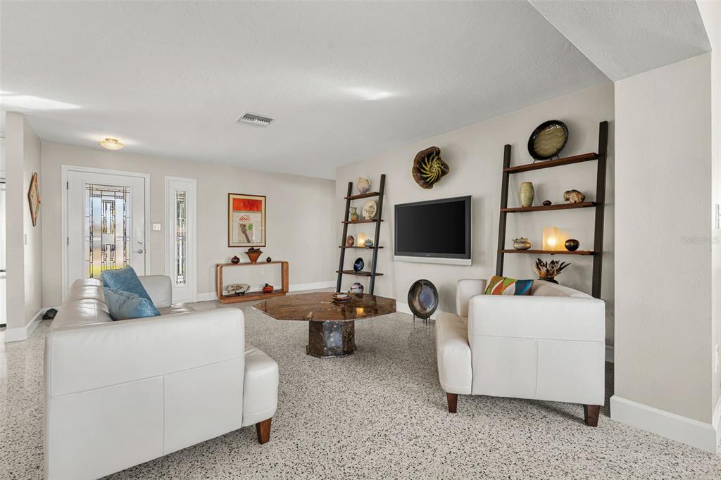 4908 Arlington Road Palmetto, FL 34221 - Photo 6 of 36 a living room with furniture and a flat screen tv