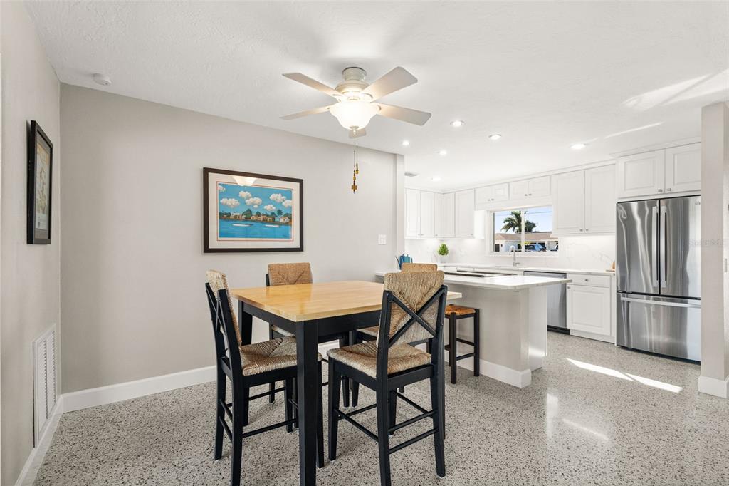 4908 Arlington Road Palmetto, FL 34221 - Photo 9 of 36 a view of a dining room with furniture and a chandelier