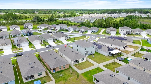 a view of multiple houses with yard