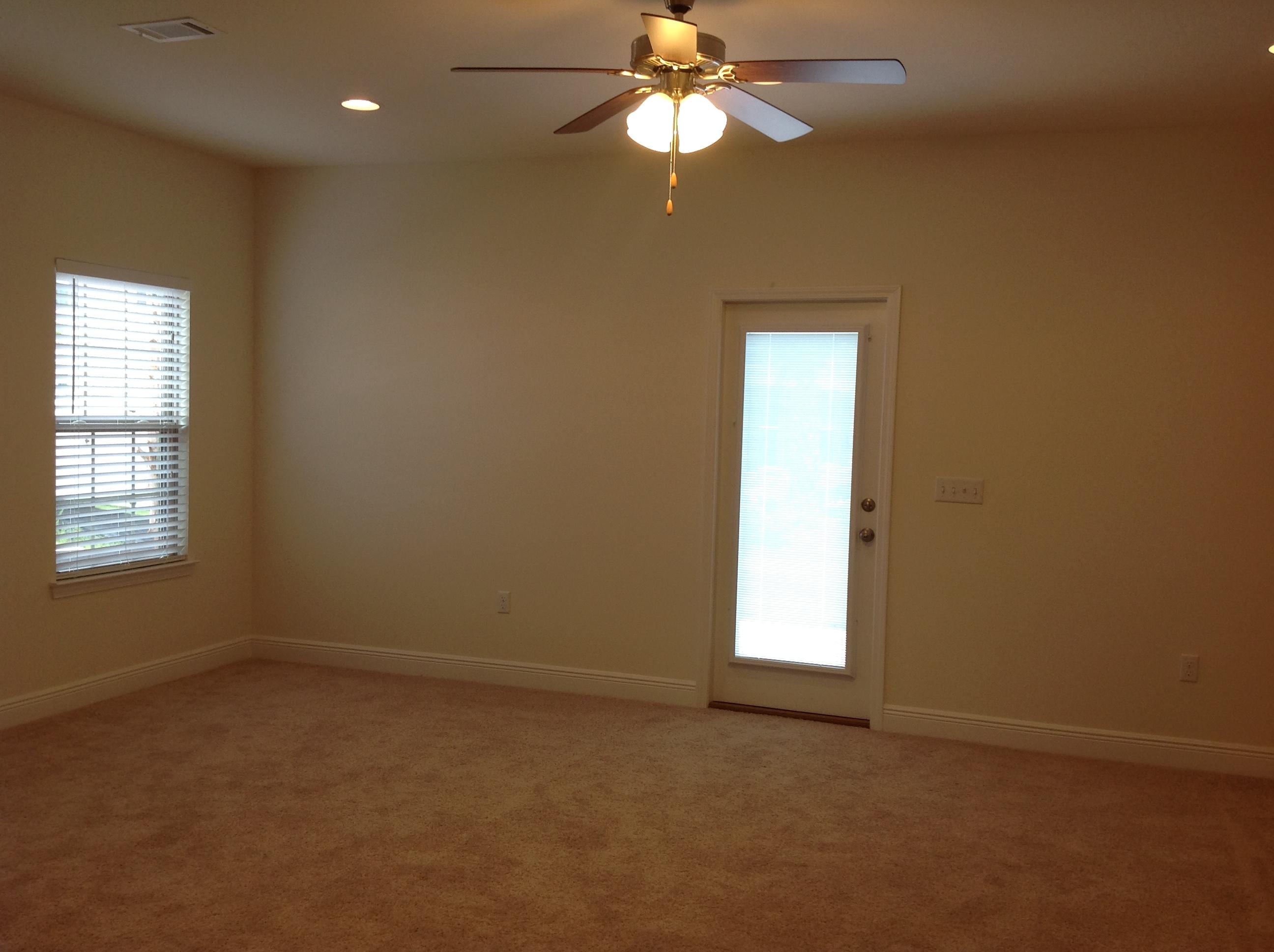 2131 Wilsons Plover Circle Navarre, FL 32566 - Photo 2 of 19 an empty room with a window and a fan