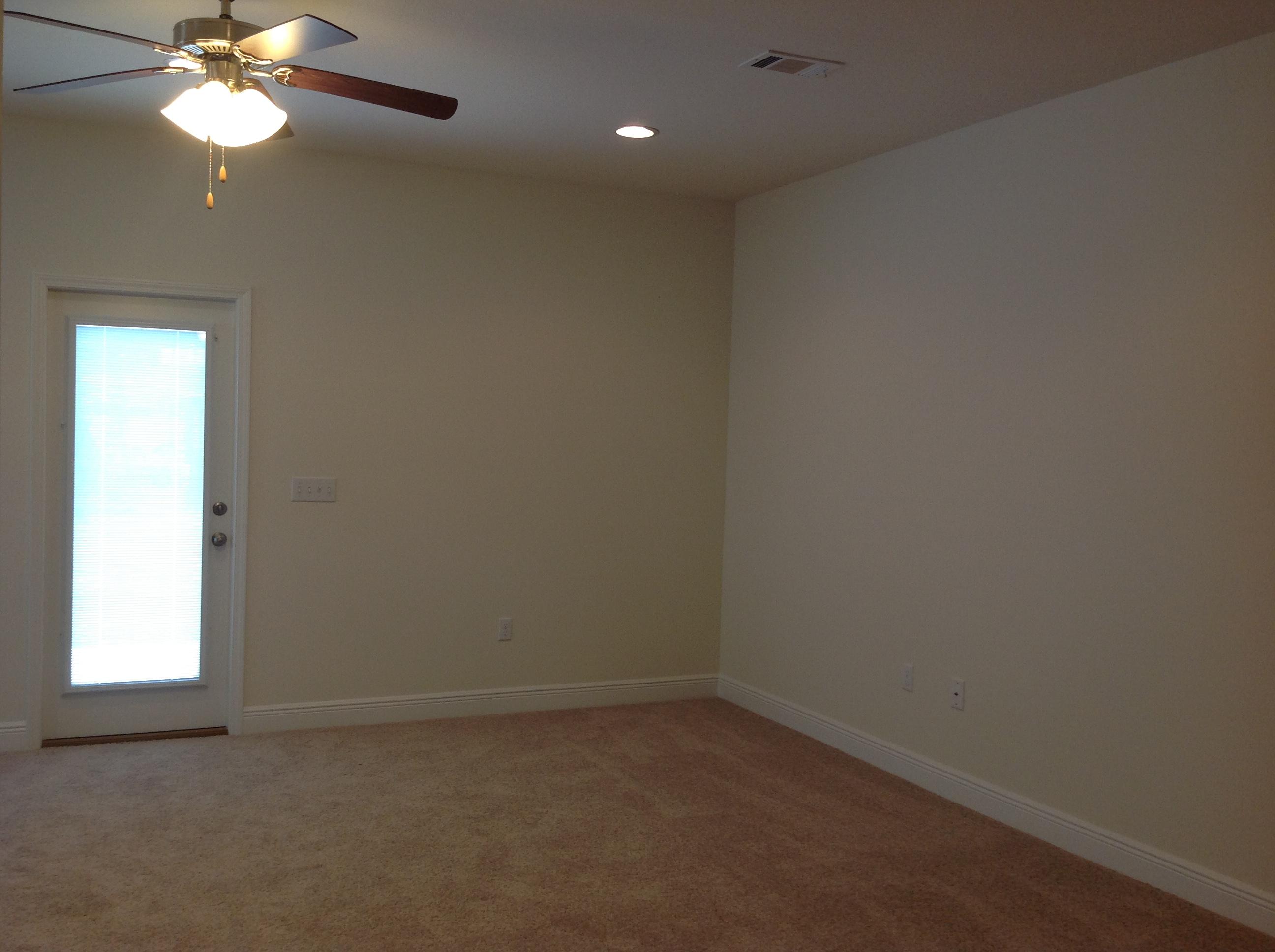 2131 Wilsons Plover Circle Navarre, FL 32566 - Photo 3 of 19 an empty room with a window and a fan