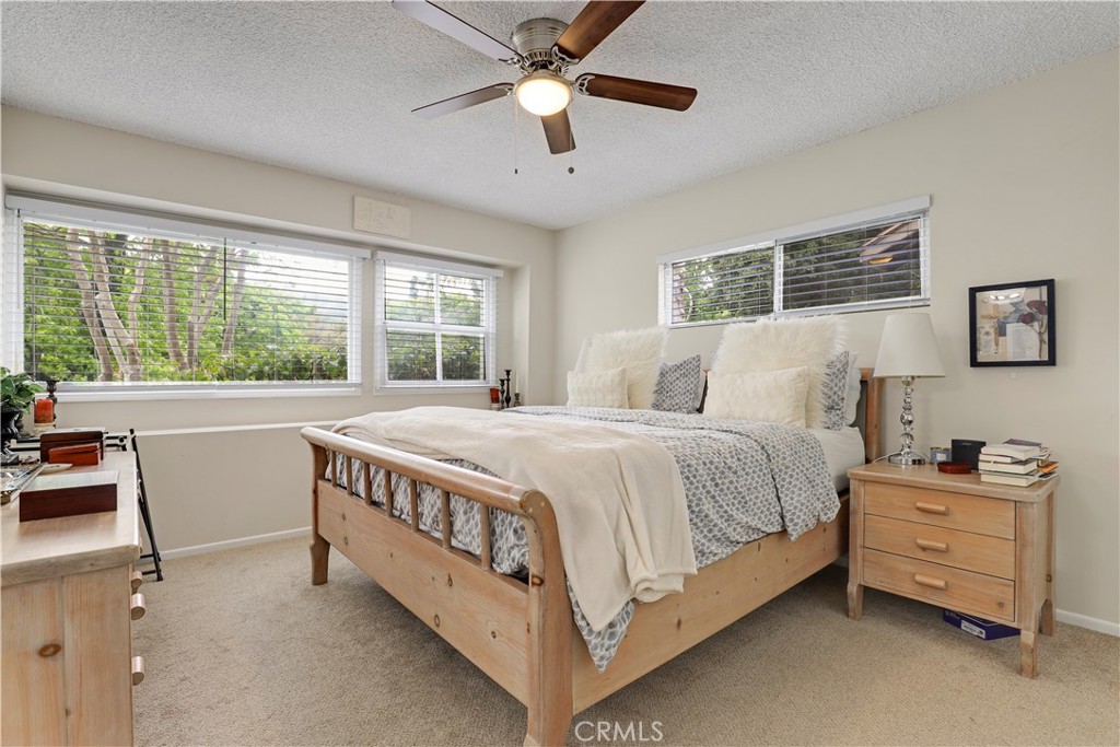 6237 Hamilton Lane La Crescenta, CA 91214 - Photo 15 of 45 a spacious bedroom with a bed and a chandelier