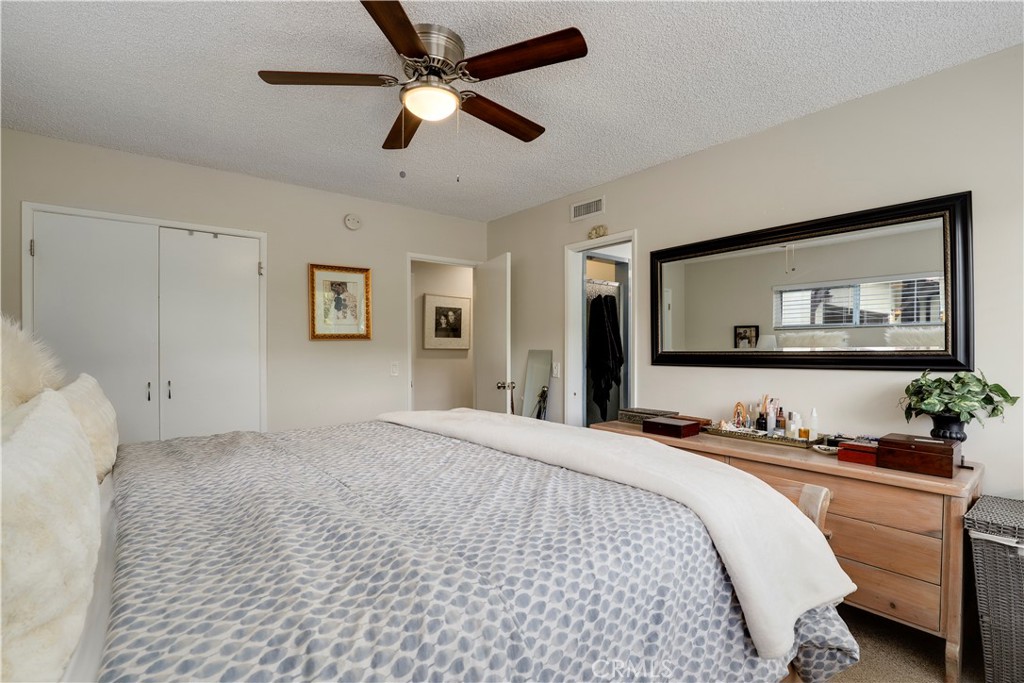 6237 Hamilton Lane La Crescenta, CA 91214 - Photo 16 of 45 a bedroom with a large bed and a large mirror