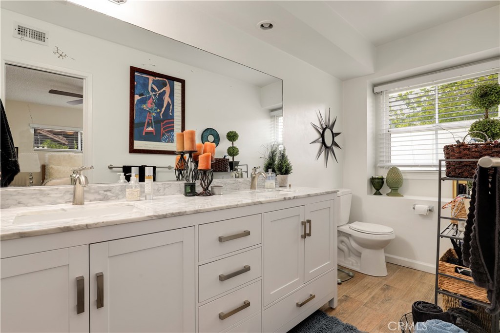 6237 Hamilton Lane La Crescenta, CA 91214 - Photo 17 of 45 a bathroom with a granite countertop sink mirror and toilet