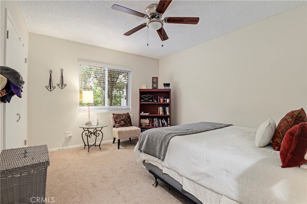 6237 Hamilton Lane La Crescenta, CA 91214 - Photo 19 of 45 a bedroom with a bed and a chandelier