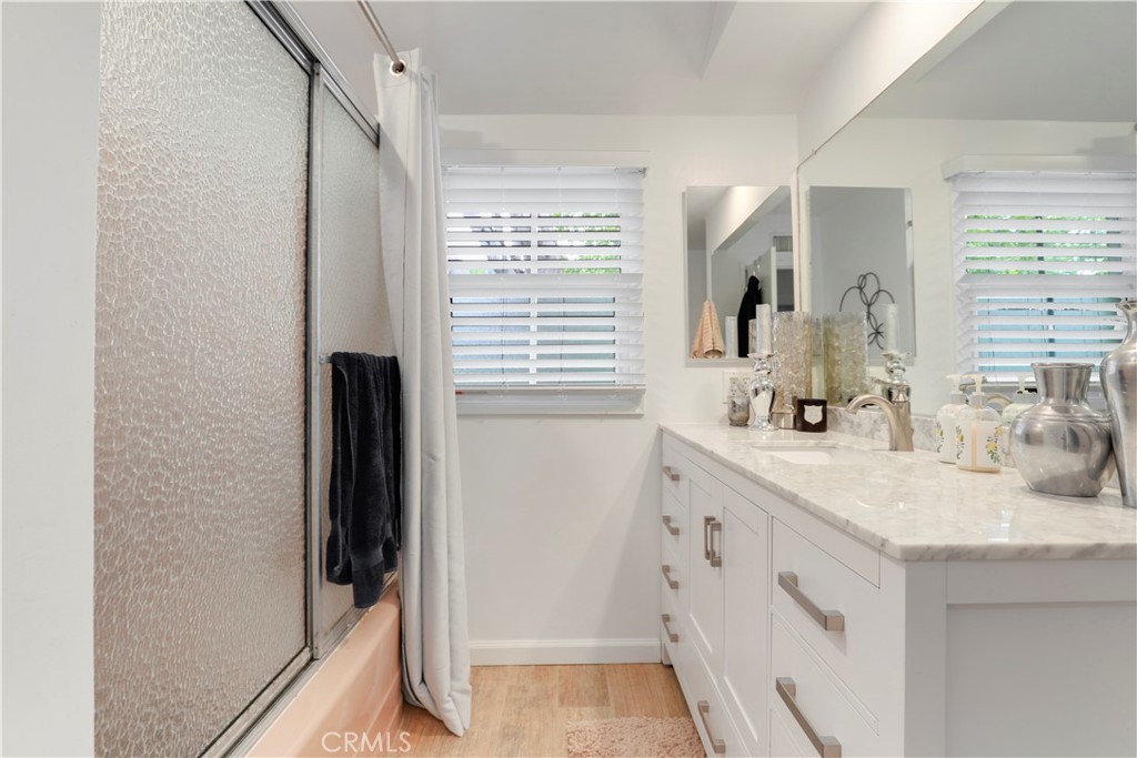 6237 Hamilton Lane La Crescenta, CA 91214 - Photo 22 of 45 a bathroom with a sink a mirror and a shower