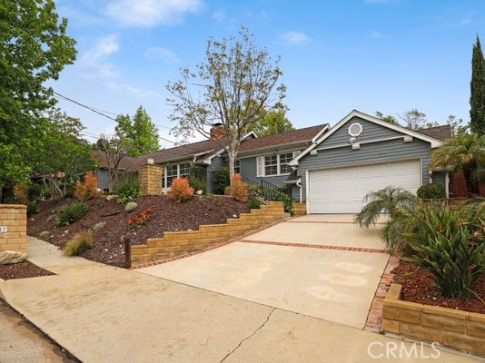6237 Hamilton Lane La Crescenta, CA 91214 - Photo 31 of 45 a front view of a house with a yard and garage