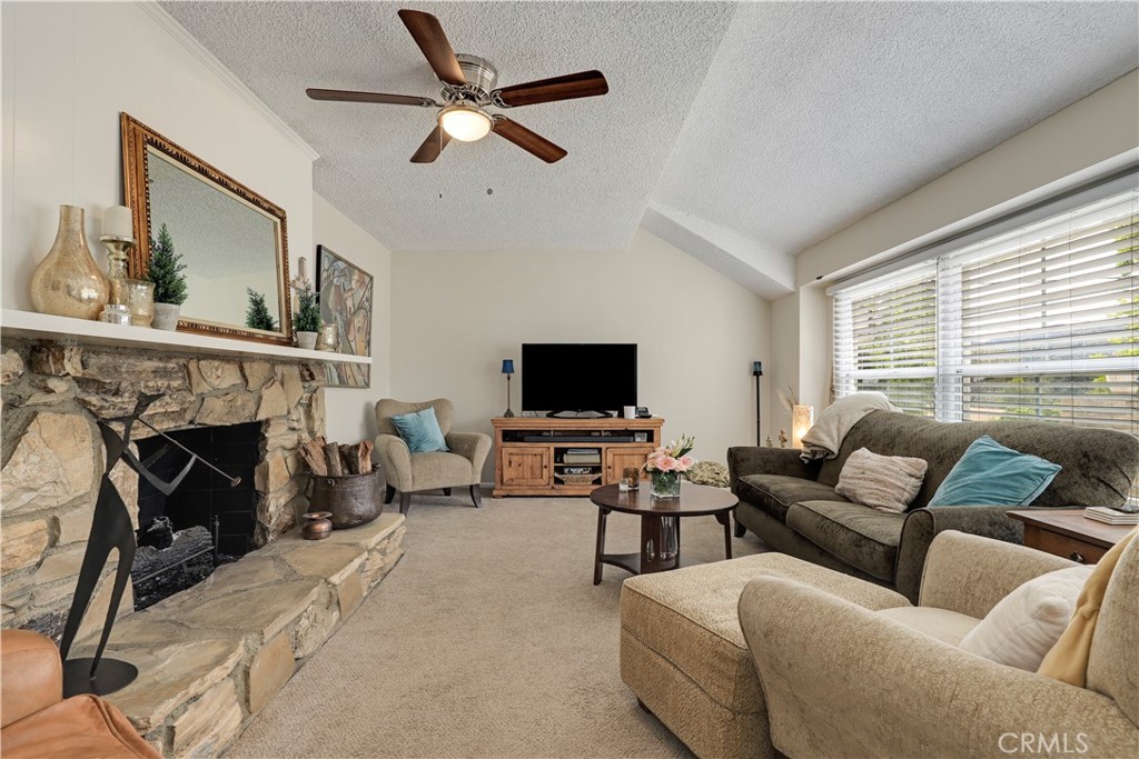 6237 Hamilton Lane La Crescenta, CA 91214 - Photo 5 of 45 a living room with furniture a fireplace and a flat screen tv