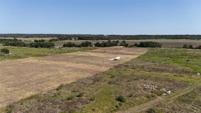 an aerial view of houses with yard
