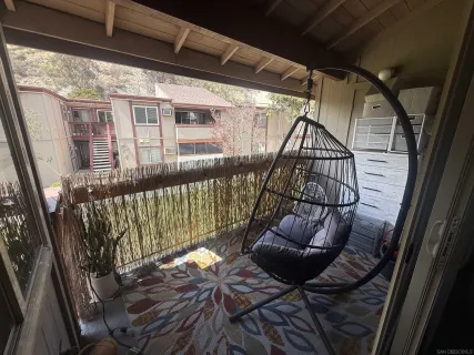 a view of balcony with furniture