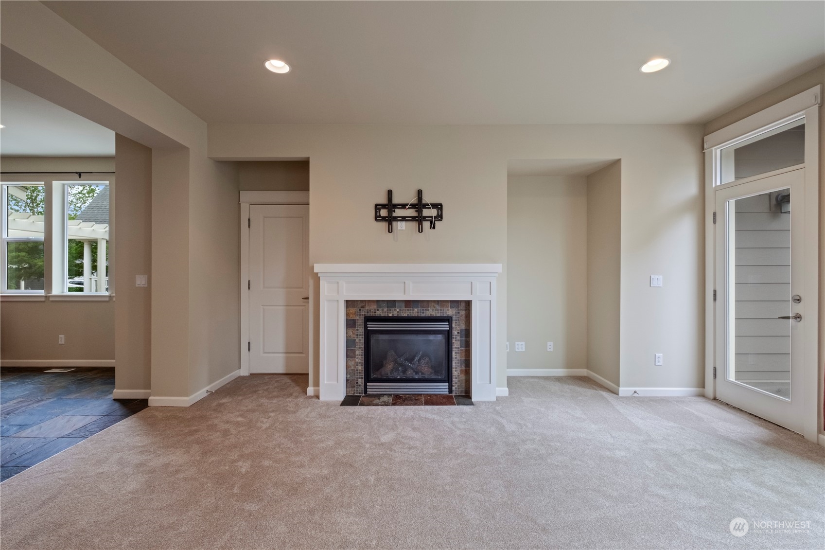 574 Lyons Place Northeast Renton, WA 98059 - Photo 15 of 39 an empty room with furniture and a fireplace