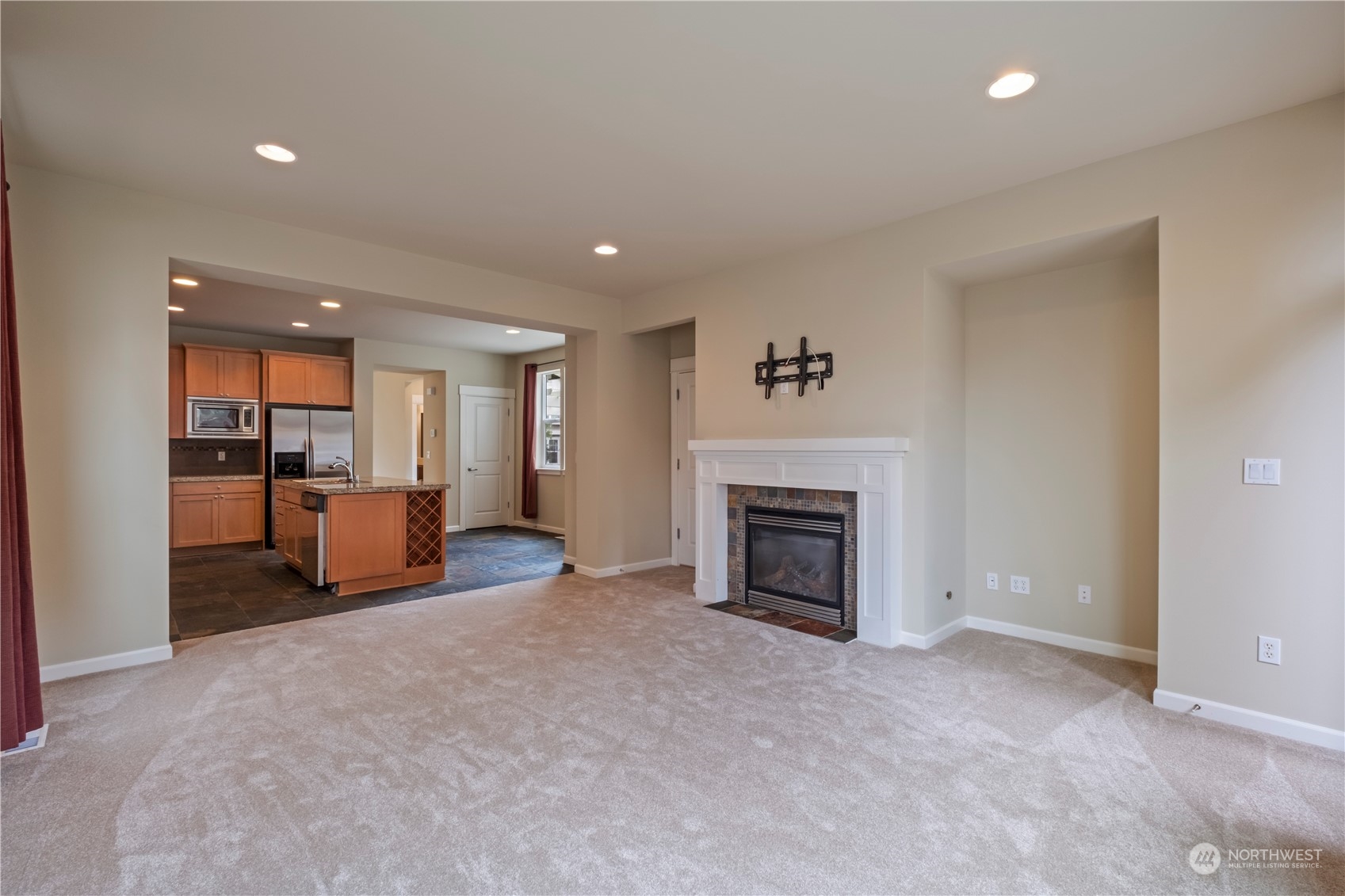574 Lyons Place Northeast Renton, WA 98059 - Photo 16 of 39 an empty room with furniture and a fireplace