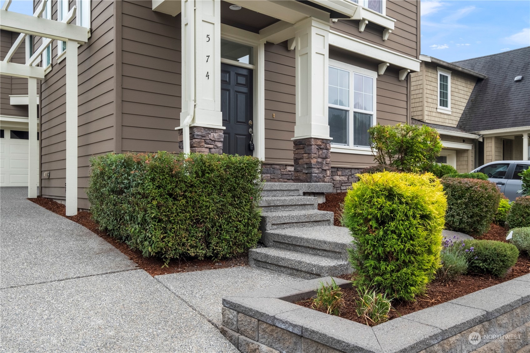 574 Lyons Place Northeast Renton, WA 98059 - Photo 3 of 39 a view of a house with potted plants