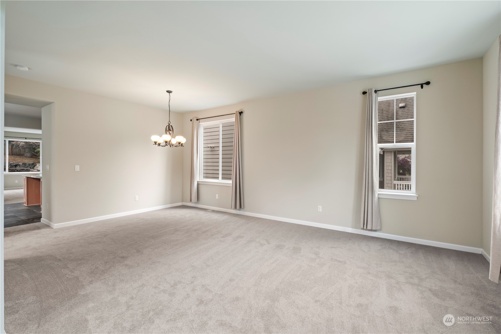 574 Lyons Place Northeast Renton, WA 98059 - Photo 5 of 39 a view of an empty room with a window