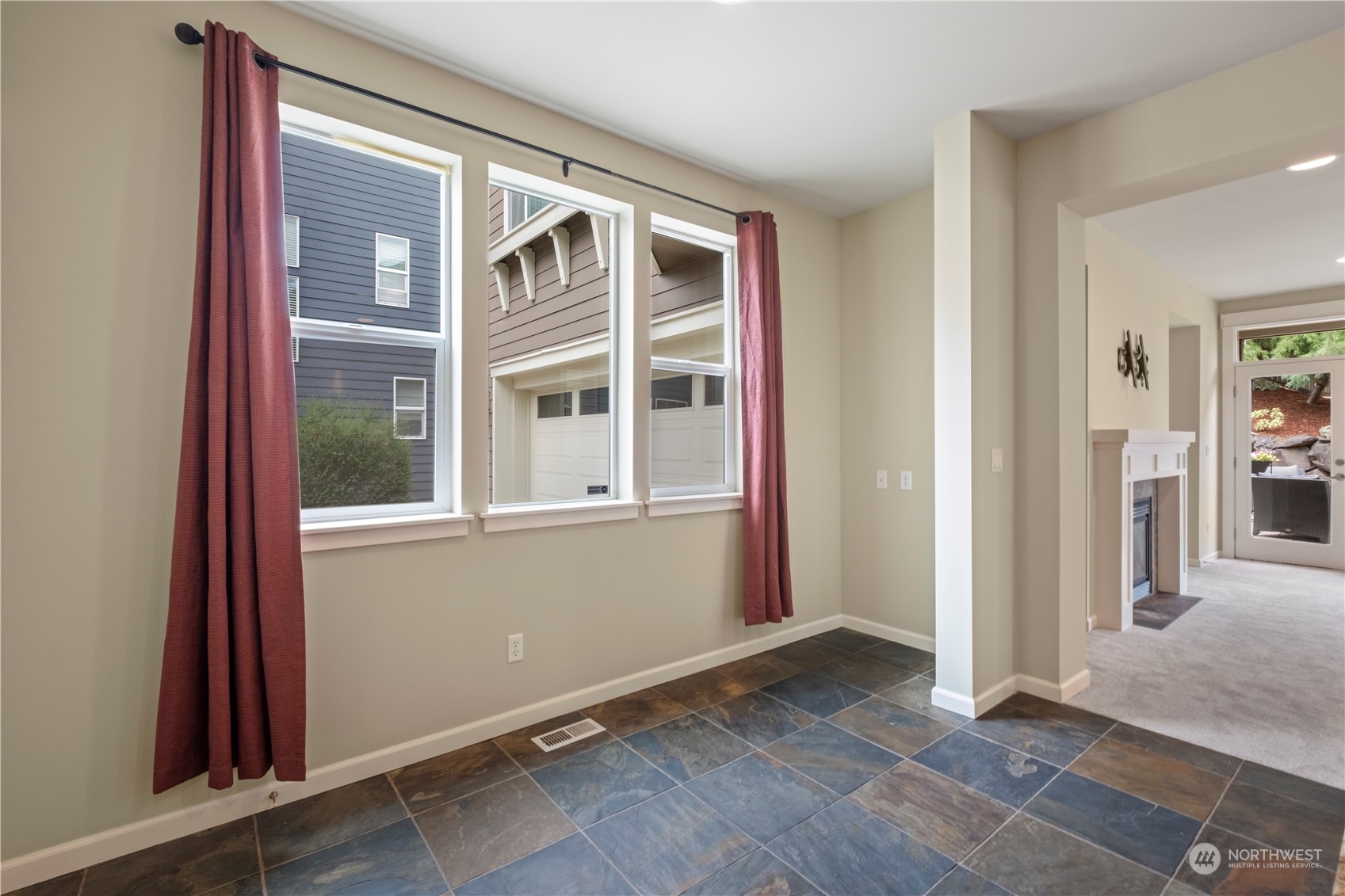 574 Lyons Place Northeast Renton, WA 98059 - Photo 10 of 39 an entryway with wooden floor and windows