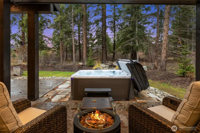 a view of a patio with couple of chairs