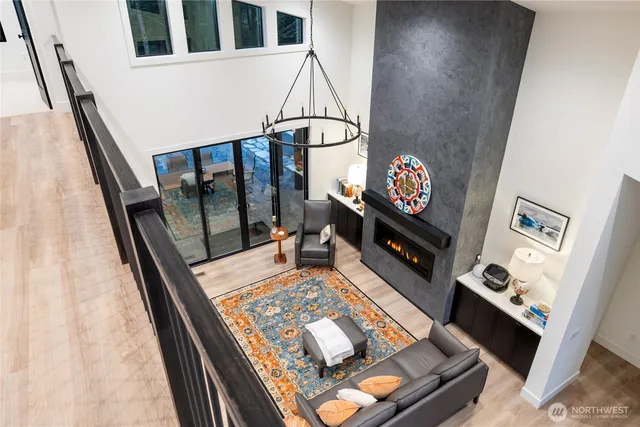 a living room with rug floor and a flat screen tv