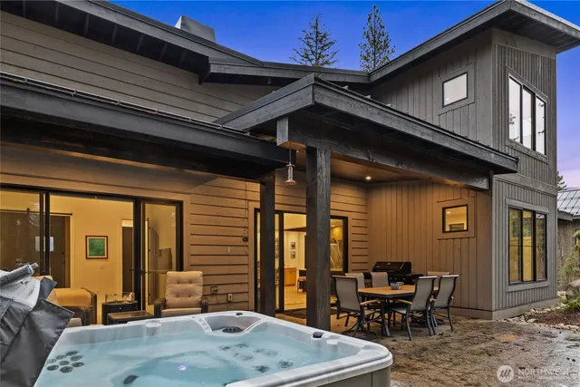 a backyard of a house with outdoor seating